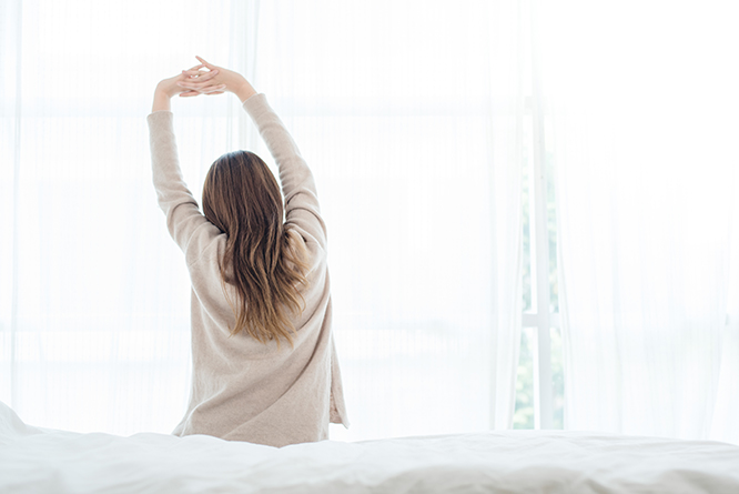 back-view-happy-beautiful-young-asian-woman-waking-up-morning-sitting-bed-2.jpg